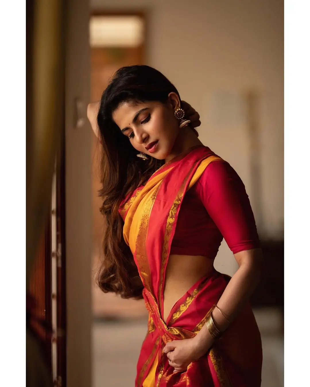 Indian Girl Iswarya Menon In Traditional Orange Saree Sleeveless Blouse